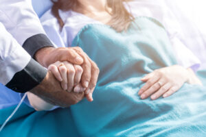holding-patients-hand--scaled